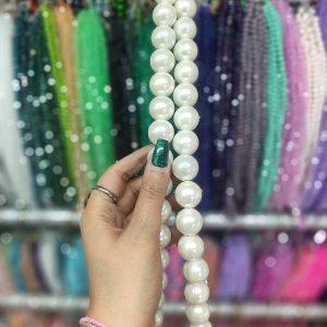 مروارید پلاستیکی رنگ کرم سایز 20 (ریسه ای)